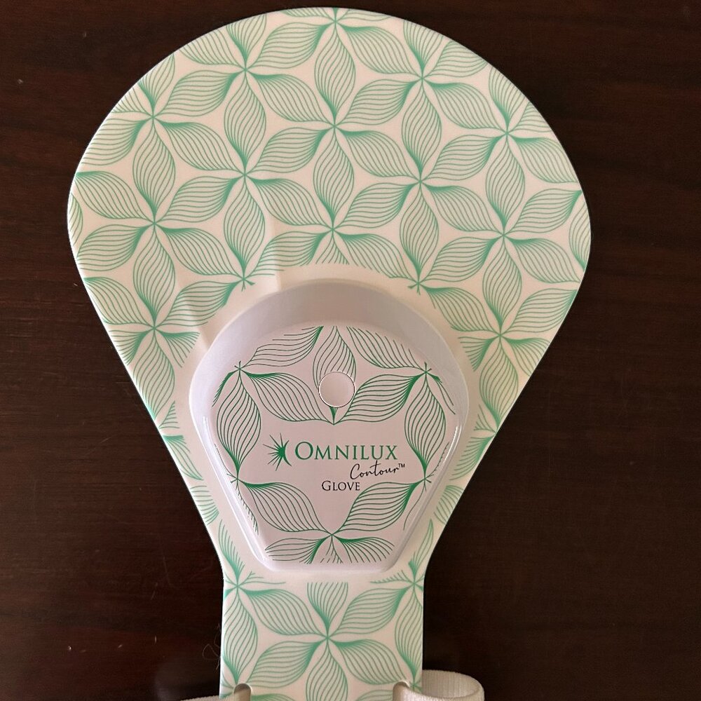 Omnilux glove LED light therapy device.